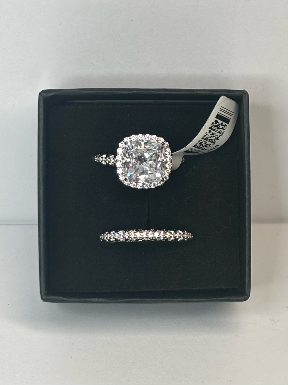 A rhodium-plated sterling silver ring set with 10+ carats of white CZ stones